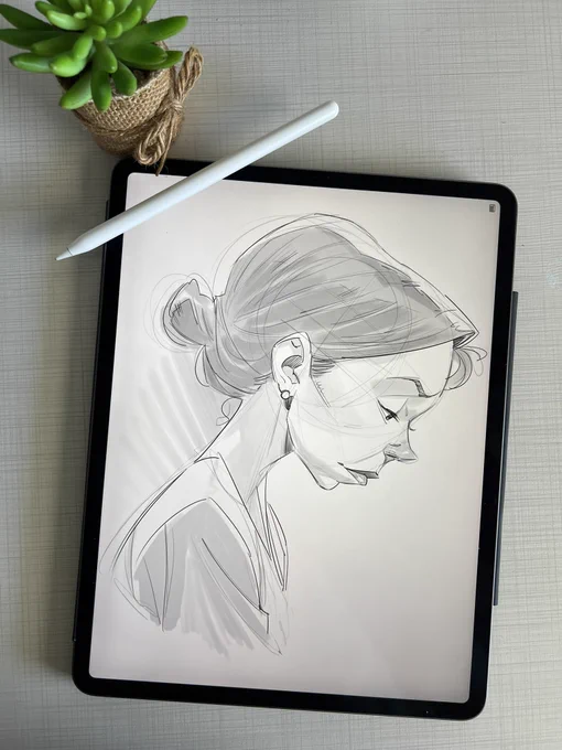 Pencil sketch of a woman in profile looking down sad on an iPad.