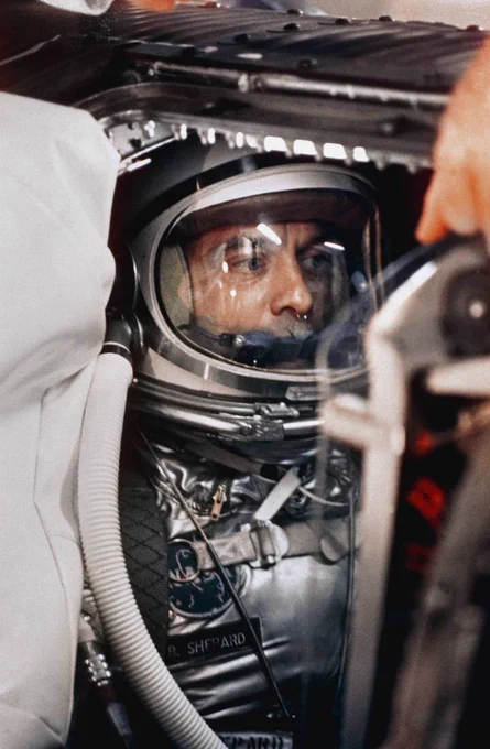 View of NASA astronaut Alan B. Shepard, Jr. in his space suit with his helmet on inside the Mercury capsule. He is undergoing a flight simulation test on April 29, 1961, with the capsule mated to the Redstone booster. Credit: NASA