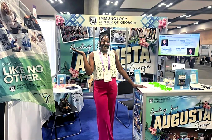 Woman standing at conference booth