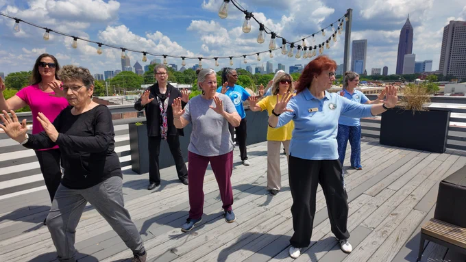 A group of people performing Tai Chi