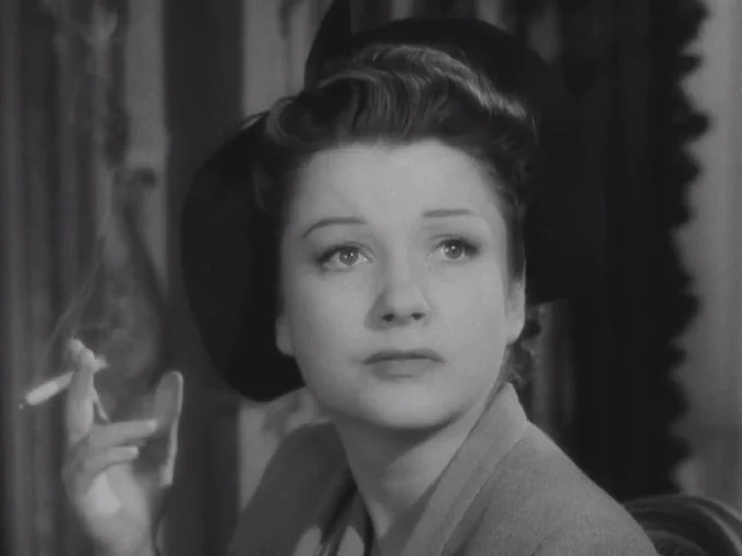 A black and white still from The Razor's Edge featuring Sophie MacDonald played by Anne Baxter.