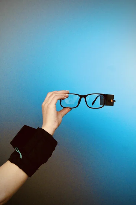Hapware glasses in front of a blue background