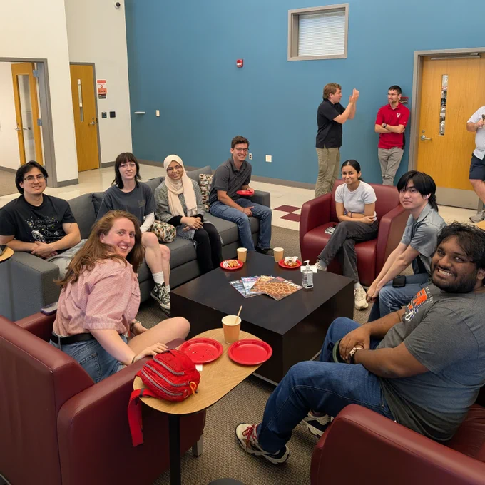 Student employees sit in a circle.