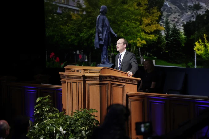 Hal Boyd speaks at a podium at BYU Devotional, May 2025