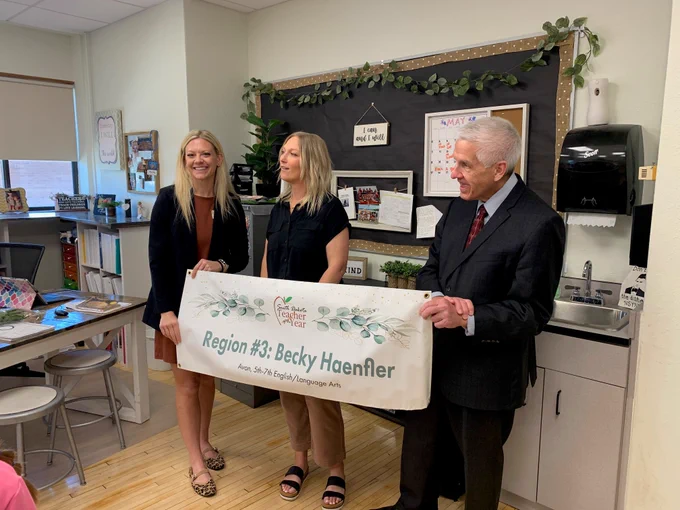 Region 3 Teacher of the Year Becky Haenfler, flanked by DOE's Allison Englund and Secretary Graves