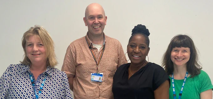 Pictures shows four people standing next to each other. This includes our social work colleagues who spoke at the NAPSW conference. 