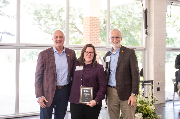 President Clements and Provost Jones posing for a photo with an award winner.