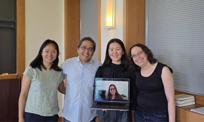 Vera, Andrés, Sunnie, Olga, and Jenn (on Sunnie's laptop screen) celebrating 🎉