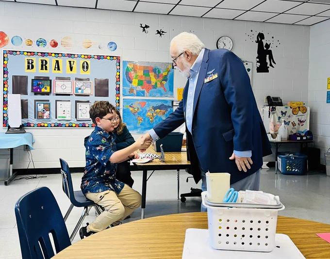 Man and boy shaking hands