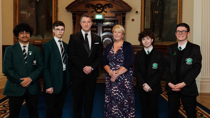 Guest judges John Finucane MP and Kathryn Collie with student participants from finalist schools, Campbell College and St. Malachy's College. 