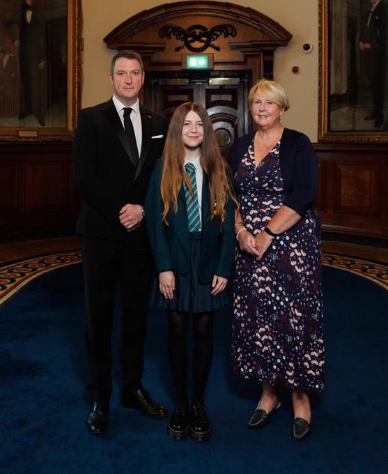 Guest judges John Finucane MP and Kathryn Collie with student participant Holly Hutcheon of Thornhill College
