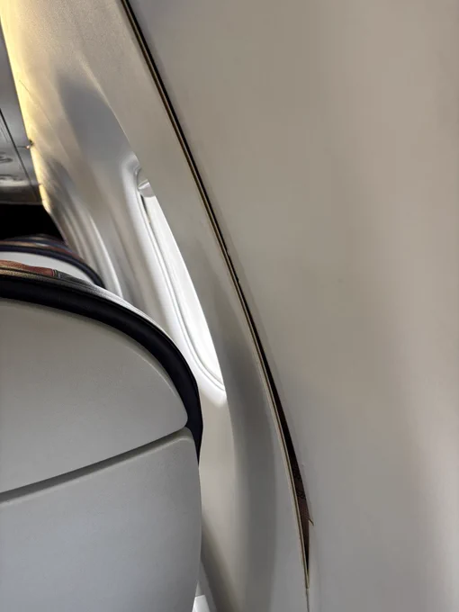 Inside paneling of an airplane starting to separate