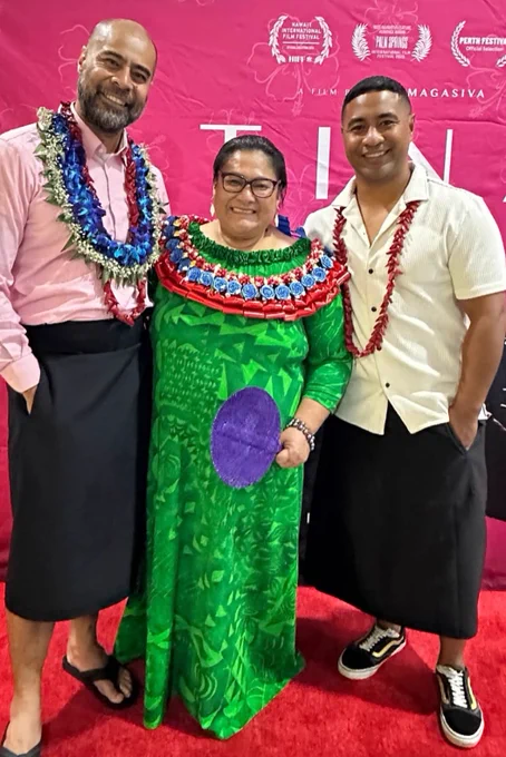 Miki Magasiva, Anapela Polataivao, Beulah Koale standing in front of the Tinā Film movie poster