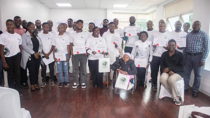 AWS Graduates posing with their certifications
