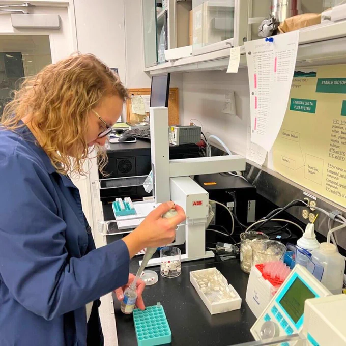A USGS scientist prepares water samples to be analyzed.