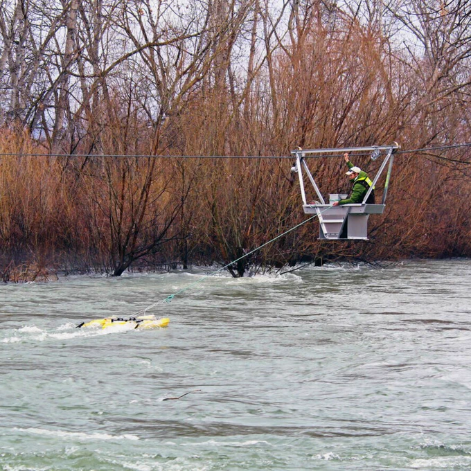 A USGS hydrologic technician collects streamflow data from the Boise River at streamgage station 13206000 using an acoustic Doppler current profiler.