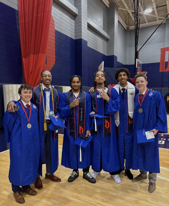 Drew Weil, Cam Crawford, Tre Dinkins, Maximus Edwards, Jahsean Corbett, Conlan O’Donoghue smiling together at graduation