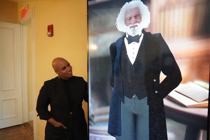 Rep. Ayanna Pressley asks AI Frederick Douglass a question at the Boston Museum of African American History. 