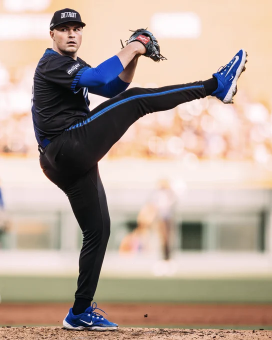 Tarik Skubal winds up for a pitch with his signature high-leg in a Tigers City Connect uniform.