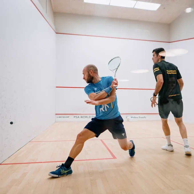 Gregoire Marche and Rui Soares on court during their first round match at the PSA World Championships 