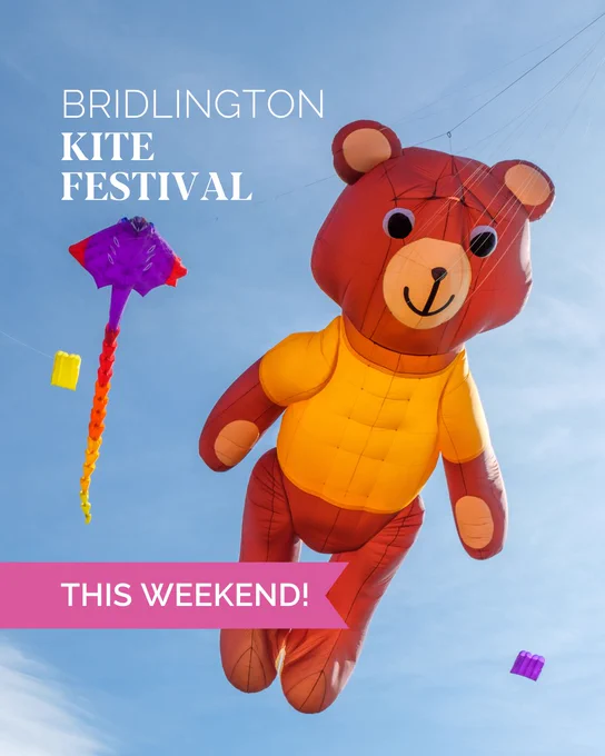 A teddy bear inflatable kite with the words Bridlington Kite Festival this weekend