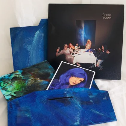 Contents of the deluxe box edition of the Lesteria album, spatium, including a small original painting, a signed photo of the artist, and the limited edition vinyl in a hand-painted box