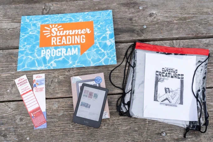Summer reading prizes including a clear stadium bag, an eReader and Red Robin Burgers for Books coupons 