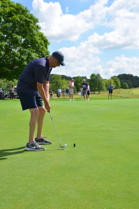 Practice putts at the Hope FORE Tomorrow Golf Outing