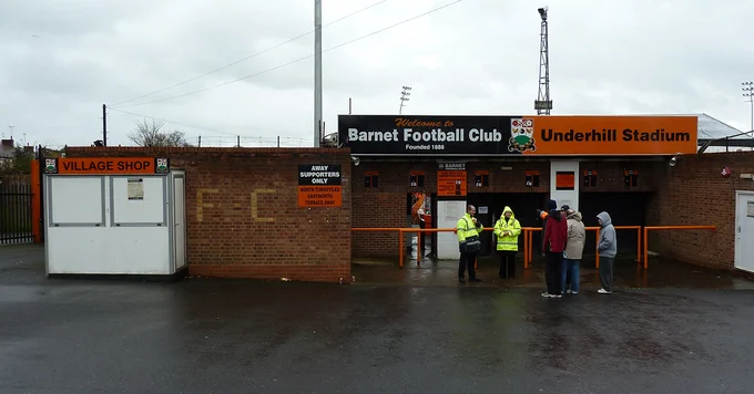 The entrance and turnstiles to Underhill Stadium on a rainy day. Former home of Barnet FC