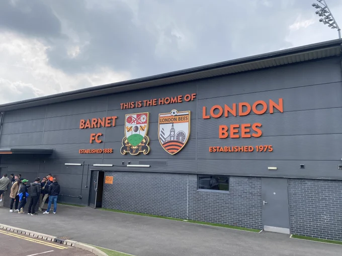 The Hive - the home of Barnet FC, showing the club crest alongside the same for the London Bees. 