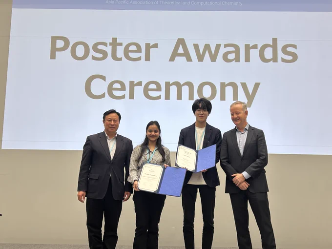 Both winners with their certificates and the conference organisers