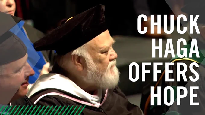 Chuck Haga wearing academic regalia at a graduation ceremony with the text 'CHUCK HAGA OFFERS HOPE' displayed.