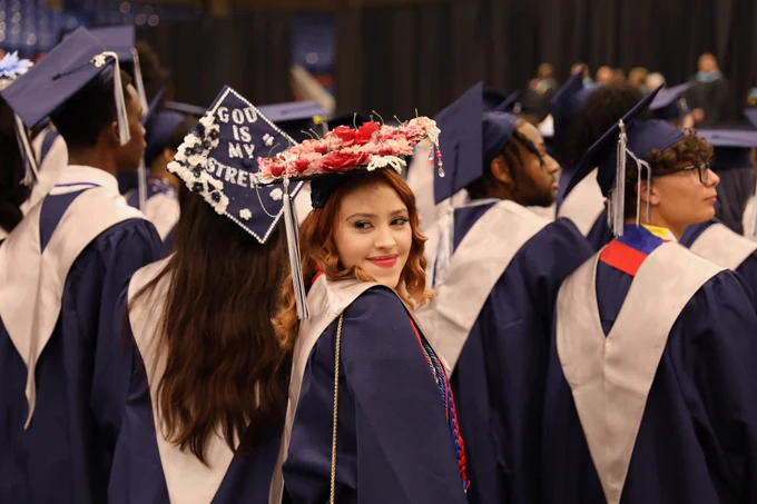 A graduate smiles.