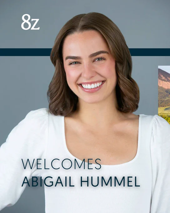 Promotional image featuring a smiling person in a white top, with '8Z welcomes Abigail Hummel' text overlay, set against a background that includes a mountain landscape.
