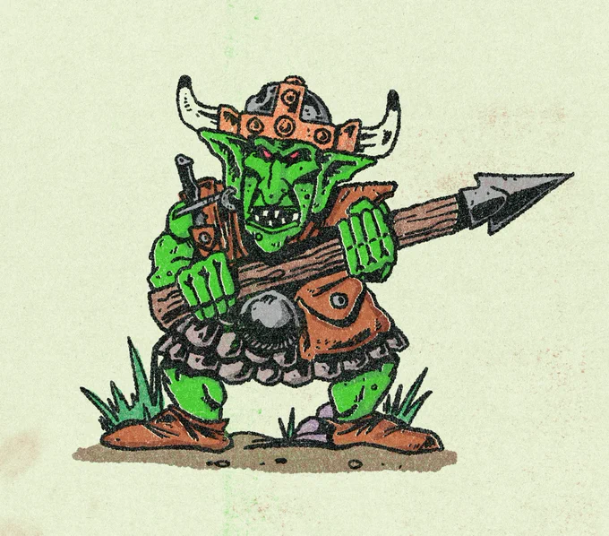 A stylised green goblin wearing a horned helmet and scale and leather armor menacingly snarls as he wields a thick wooden spear.