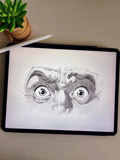 Sketch of wide, shocked eyes with intense expression on an iPad.