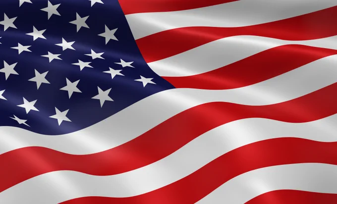 Close-up of the United States flag, featuring stars and stripes in red, white and blue.