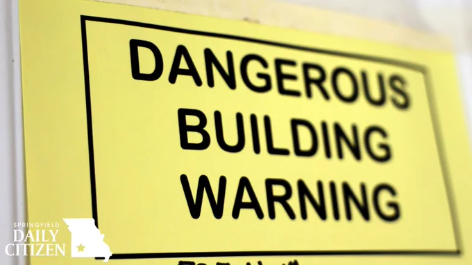 A dangerous building warning posted on the front door of a home in Springfield. (Photo by Shannon Cay)