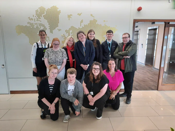 A group of TCPID students and staff with colleagues from EY