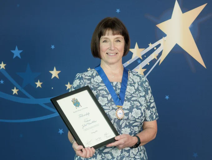 Photo of Juliet with her certificate.
