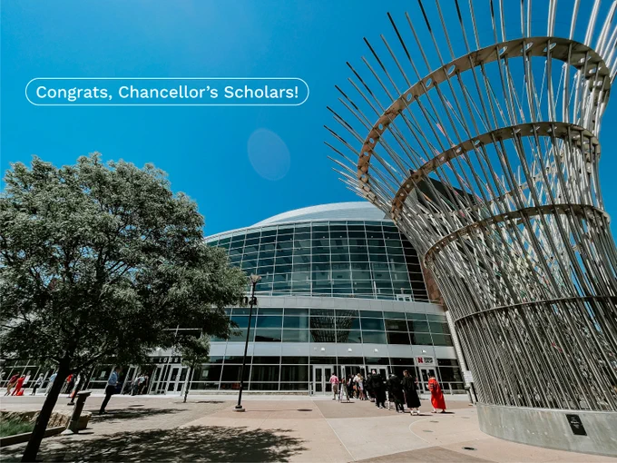 Grads line up outside of Pinnacle Bank Arena to enter the ceremony on a sunny day. Text on the graphic reads "Congrats, Chancellor's Scholars!"