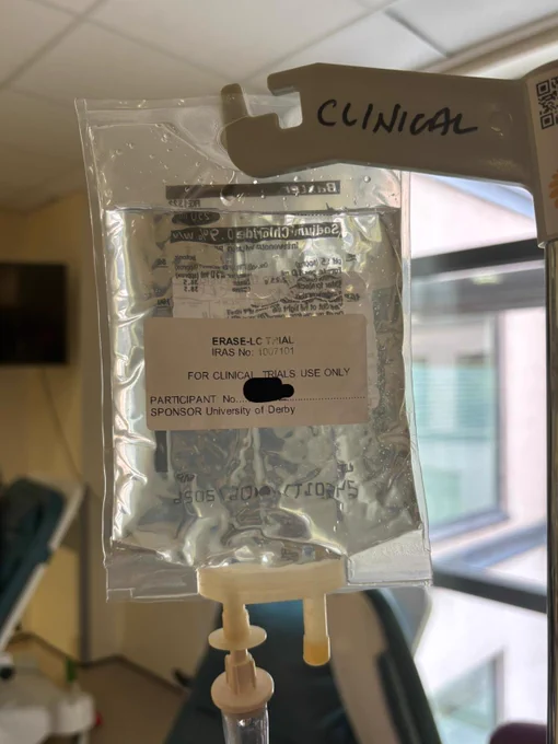 An infusion bag, hanging from a drip stand. 
