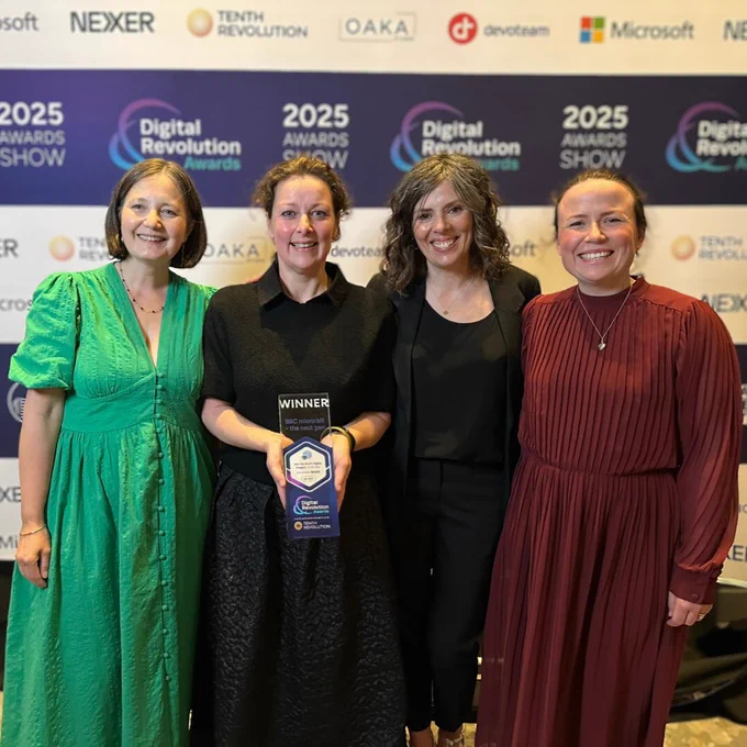 4 smiling representatives from BBC Teach, the Micro:bit Educational Foundation and Nominet, are holding a winner award at the Digital Revolution Awards 2025 ceremony. 