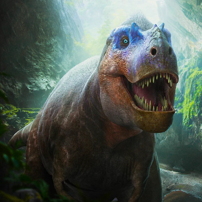 An Albertosaurus is standing outside with its jaw open and huge teeth showing.
