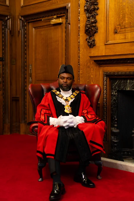 Image of Mayor of Islington, Cllr Jason Jackson in red ceremonial robes in the Mayor's Parlour.
