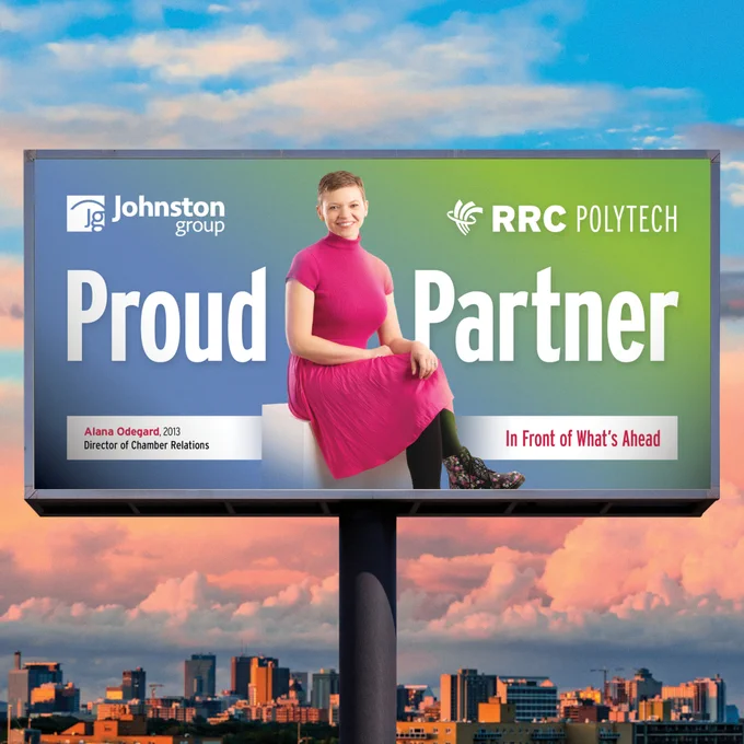 A billboard featuring Alana Odegard sitting and smiling, with text that reads: “Proud Partner” alongside logos for Johnston Group and RRC Polytech.