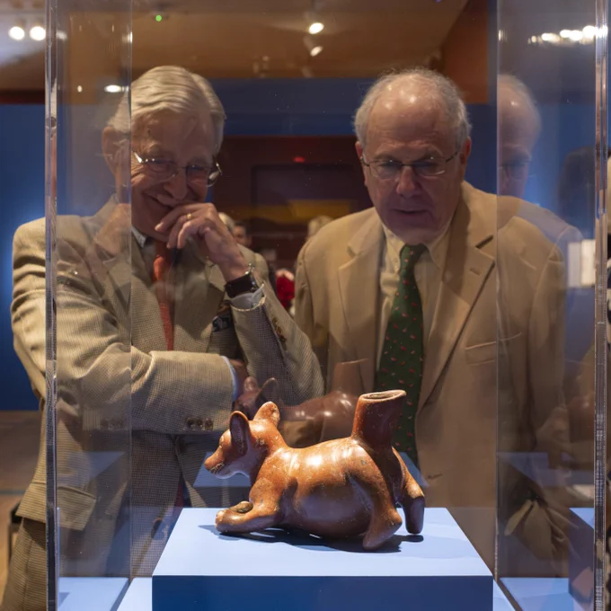 Two museum visitors view a small statue of a dog in VMFA's special exhibition "Frida: Beyond the Myth."