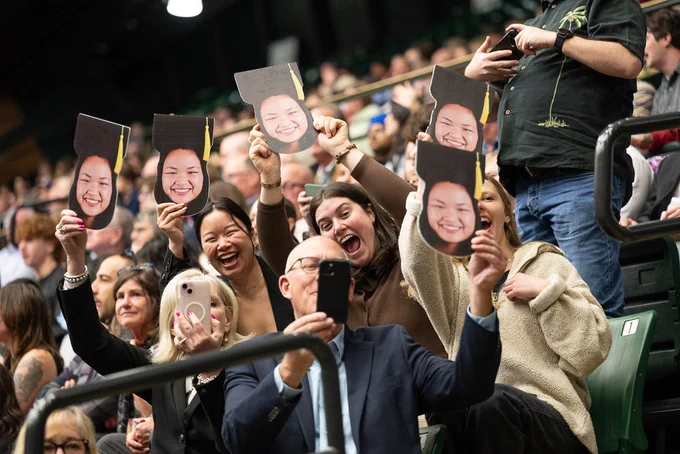Family and friends of a graduate cheer from the stands in Moby Arena.