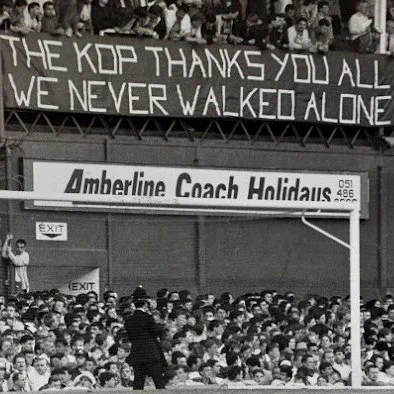 A Liverpool banner on display at Goodison Park. 'The Kop thank you all, we never walked alone'