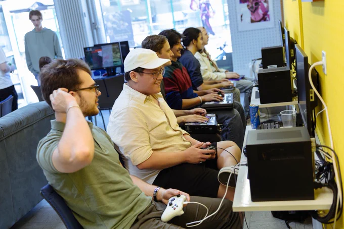 Fighting Game players playing matches in the "yellow section" of the CastleGames store in Oberburg, Switzerland during the re-opening event.